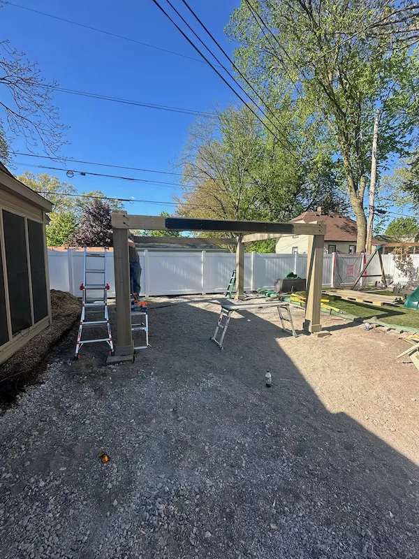 Prepared gravel base and posts for an outdoor structure
